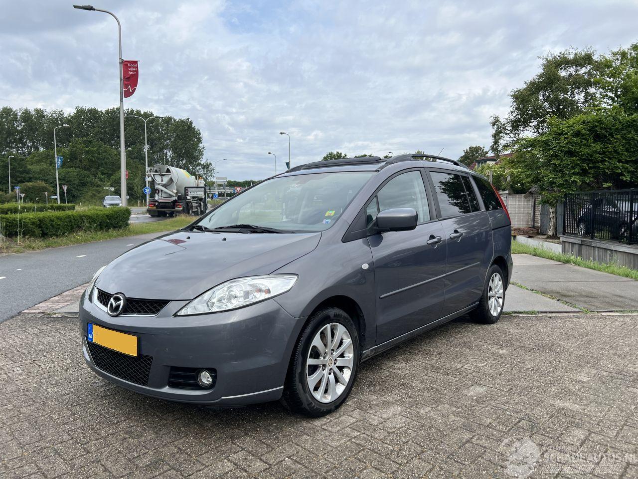 Mazda 5 1.8 S 7p brandschade motor