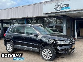 skadebil auto Volkswagen Tiguan 1.4 TSI R-Line DSG Dynaudio Stoelverwarming Climate Cruise 2014/1
