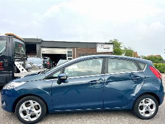 krockskadad bil auto Ford Fiesta Gereserveerd 1.25i 82pk Titanium 5drs - 94dkm nap - airco - cruise - licht + regensensor + aut dimmend binnenspiegel - lmv 2009/3